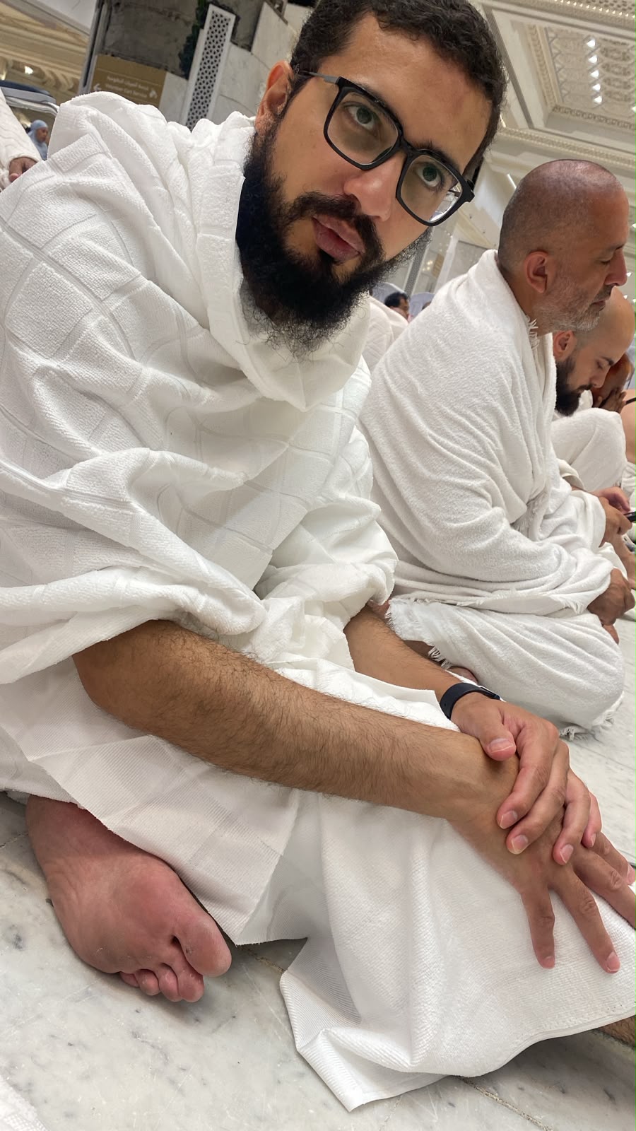A pilgrim in Ihram at the Grand Mosque
